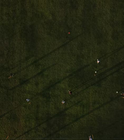 Aerial view of a Gioca training pitch at golden hour
